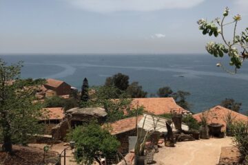 Photo overlooking buildings and the ocean